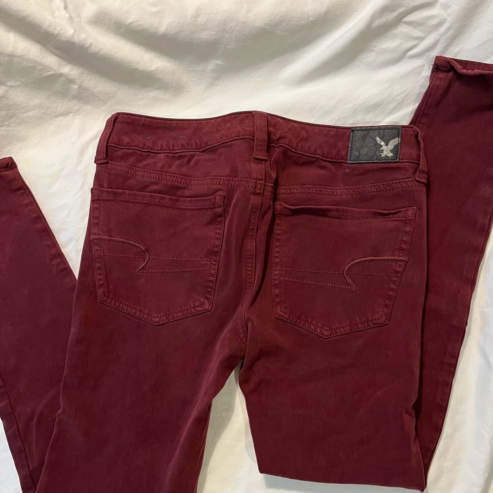 American Eagle Outfitters super stretch jean in maroon.